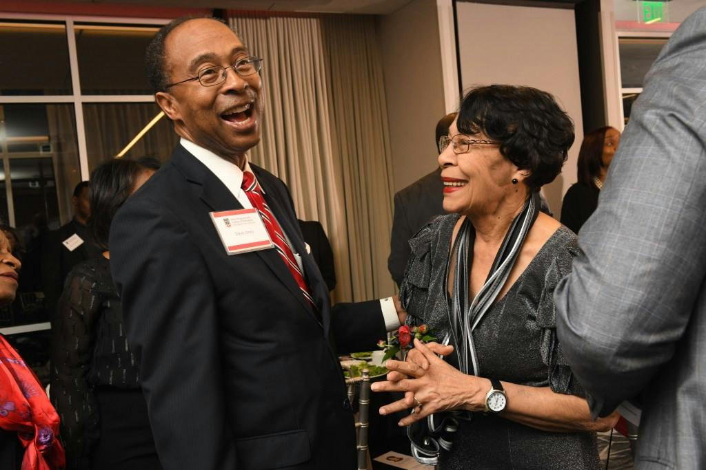 U.S. District Court Judge Steve C. Jones laughs with Early in the Magnolia Ballroom before dinner.