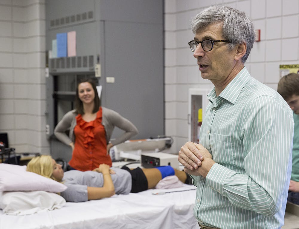 Professor Kevin McCully talks about the research being done on measuring muscle energy. Photo by Paul Elfland