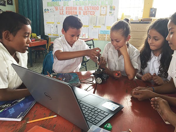 Children learning from a robot