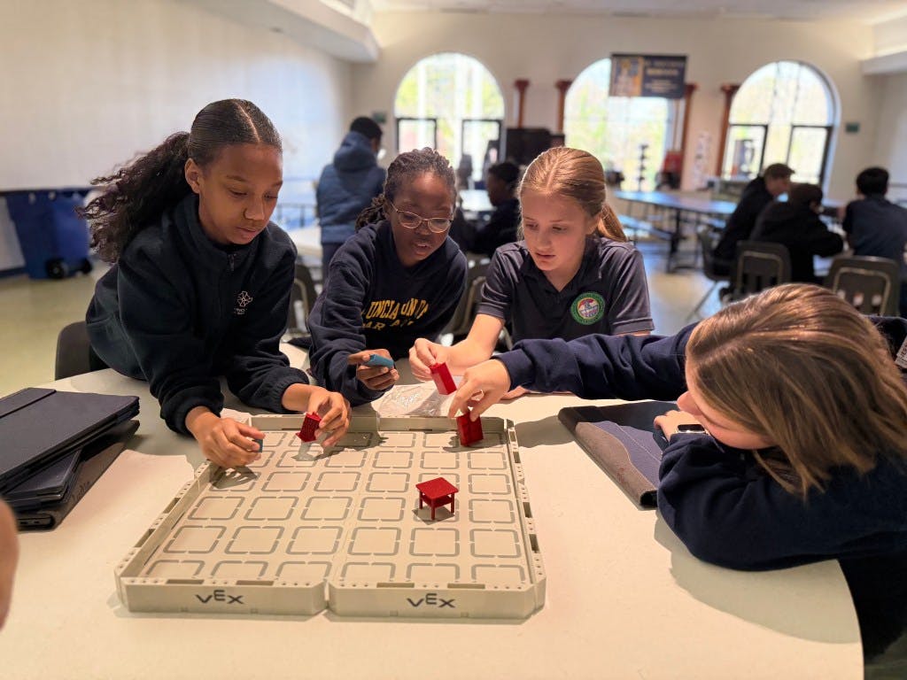 Students at the Annunciation Day School during a STEM robotics workshop.