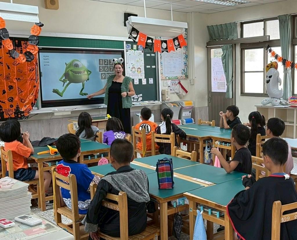 MaryQuinn Mills teaches a class of students in grades 1-8 on the Matsu Islands.