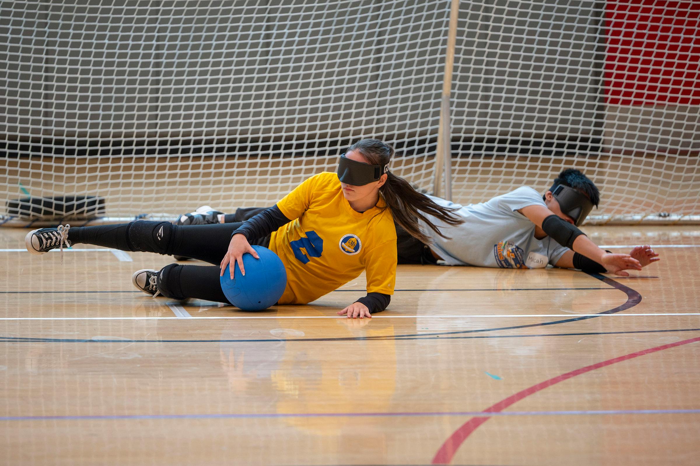Two GoalDawgs campers defend their goal as the ball approaches the net