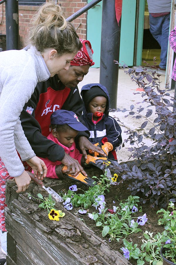 Kids planting in the garden