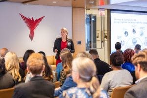 Parshall speaking at an event.